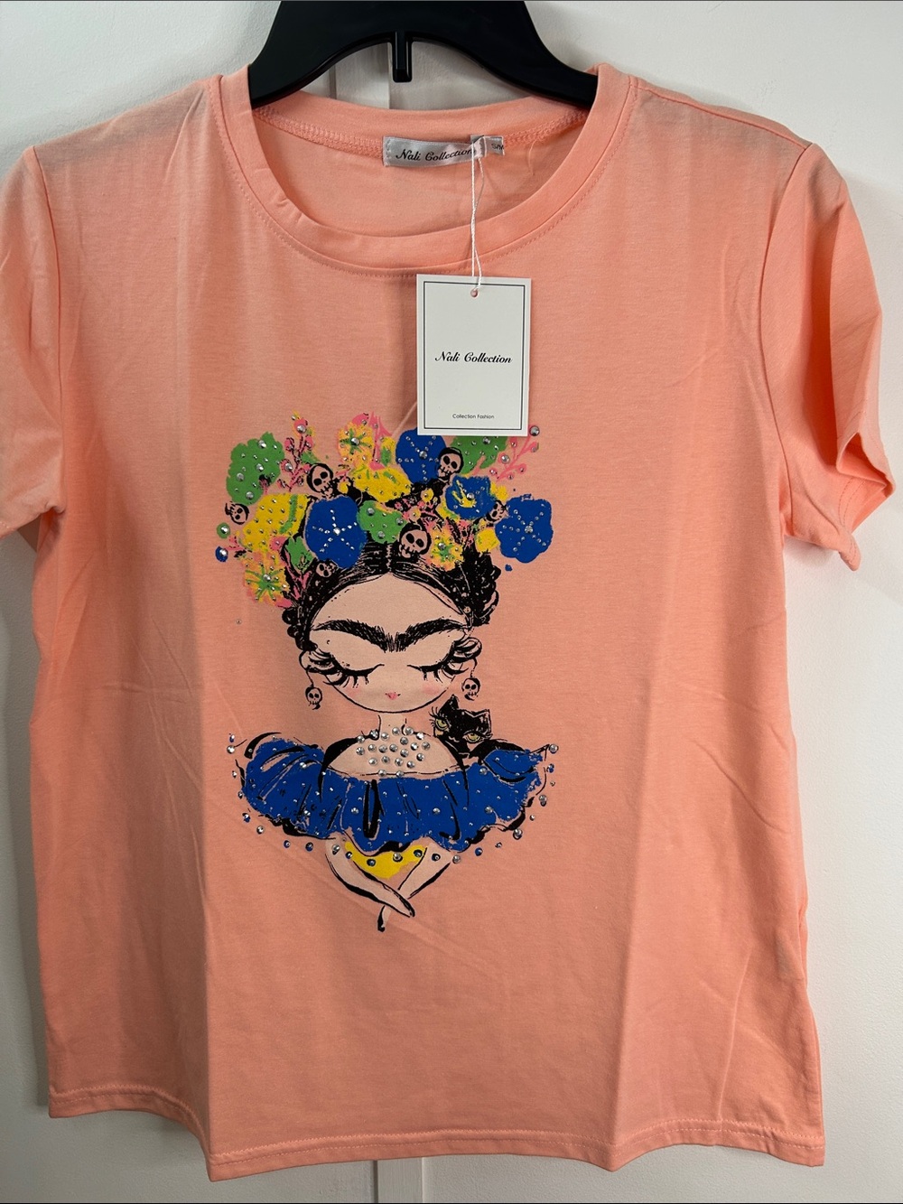 Peach Short Sleeve Graphic Tee with Blue Floral Accent
